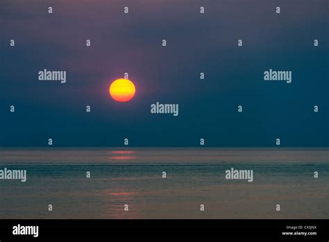 Sunrise Over The Ocean Stock Photo Alamy