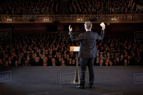 Speaker Gesturing On Stage In Theater Stock Photo Dissolve