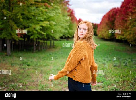 Happy Tween Girl Surrounded By Fall Color Trees Stock Photo Alamy