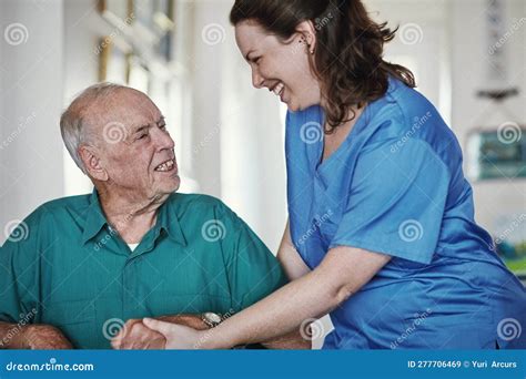 compassion is at the heart of our care a female nurse standing next to her senior patient