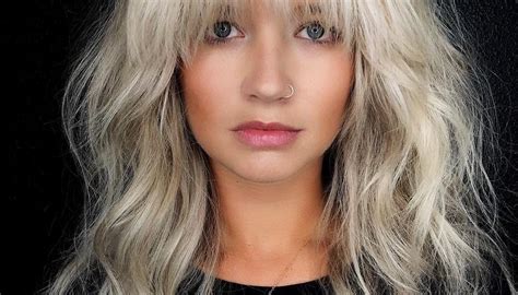 Voluminous Blonde Layered Lob With Face Framing Fringe And Messy Wavy