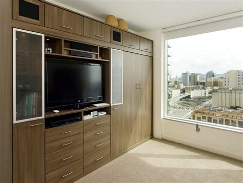 Generally, a living room is equipped with a sofa, chairs, central tables, modern wall unit, a television or stereo equipment, bookshelves and other pieces of furniture. by California Closets Las Vegas bedroom wall unit Bedroom ...