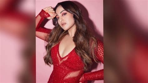 Sonakshi Sinha Goes Bold In A Shimmery Red Hot Thigh High Slit Dress