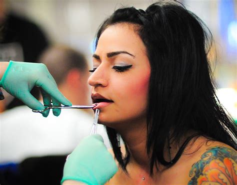 pretty girl getting her lip pierced a photo on flickriver