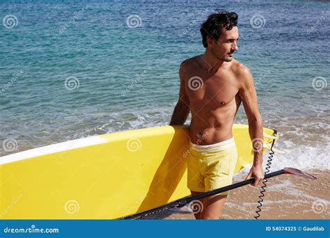 The Handsome Man The Relaxing In The Beach In A Sunny Day Stock Image