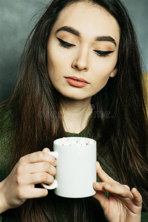 Young Asian Woman Holding Coffee Cup And Sitting On Chair At Home Stock Image Image Of Women