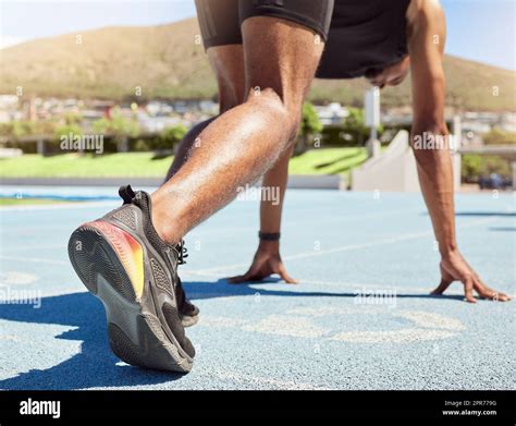 Close Up Of An Athlete Getting Ready To Run Track And Field With His