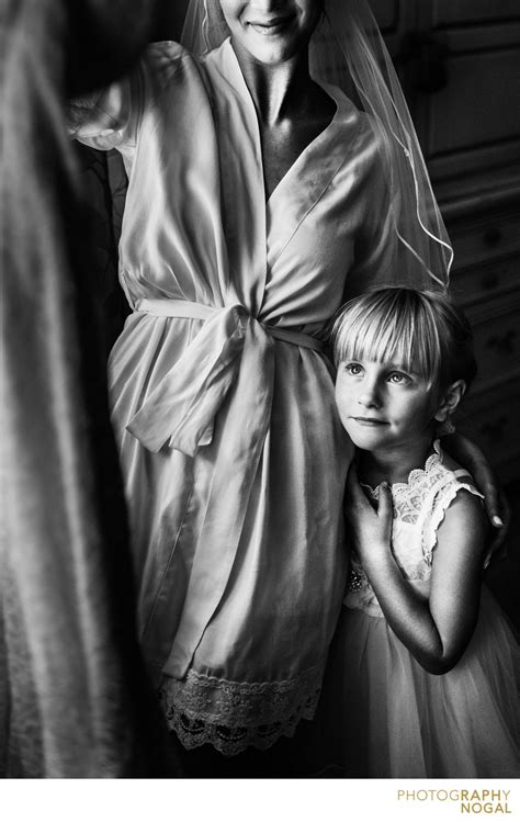 flowergirl and bride looking at the wedding dress toronto wedding photographer portfolio