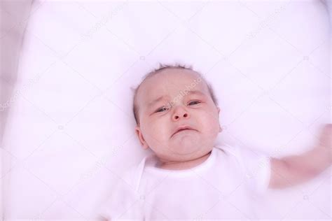 Scared Crying Baby Alone In His Crib — Stock Photo © Tiagoz 118800862
