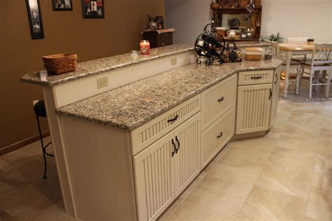 Even though the kind of cabinets you find at lowe's might not be the sort of thing that you would treasure forever or take out an insurance policy for at aviva.co.uk. Kraftmaid Alexis/Briarwood Maple Mushroom Kitchen - Transitional - Kitchen - other metro - by ...