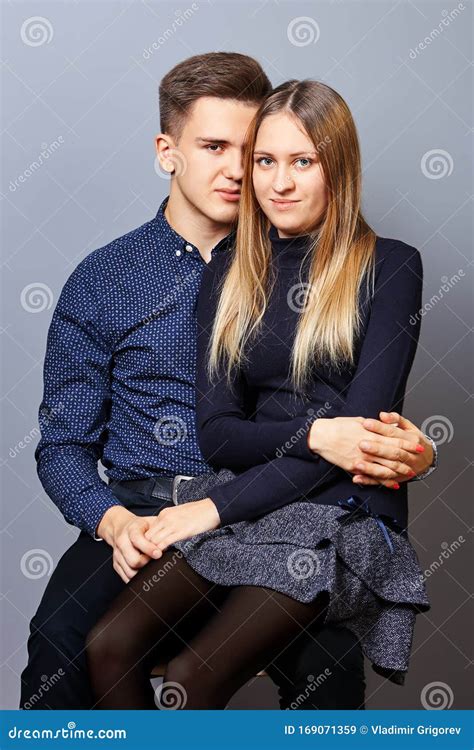 The Guy Put Girl On His Lap For A Photoshoot Stock Image Image Of Evening Dorm 169071359