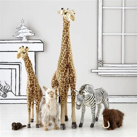 Giant stuffed giraffe are available in various types and collections such as household pets, marine animals and endangered animals. Large Plush Giraffe | The Land of Nod | Animal baby room ...