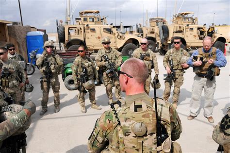 U S Army Sgt Thaddeus Hendershot Center Foreground Conducts A Pre