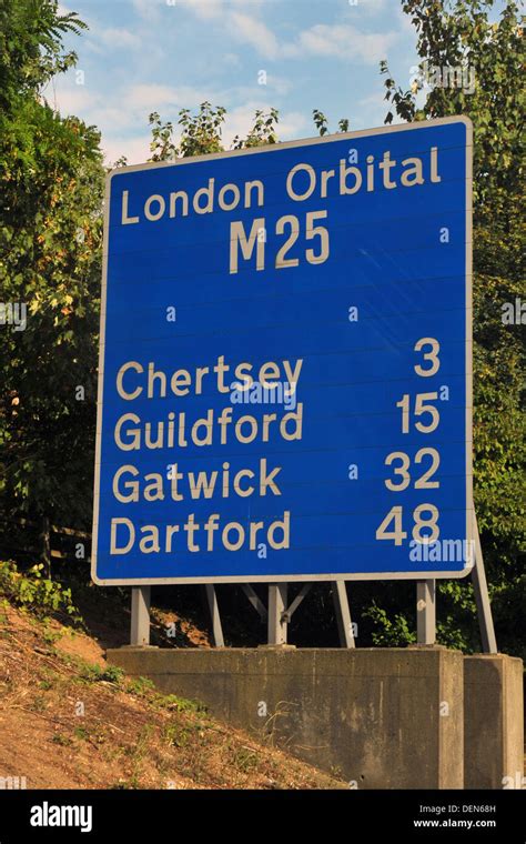 A British Road Sign Directing Traffic To Towns Around The M25 London
