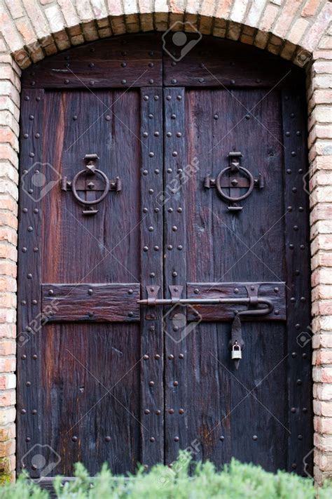 Attractive Ancient Castle Door Dark Stained Wood With Rivets And