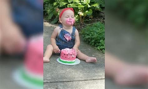 Adorable One Year Old Smashes Her Face Into A Birthday Cake Leaving Her