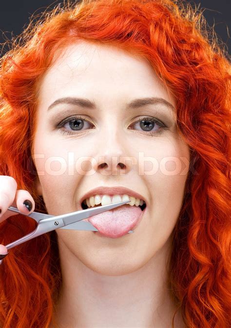 Lovely Redhead Cutting Tongue With Scissors Stock Image Colourbox