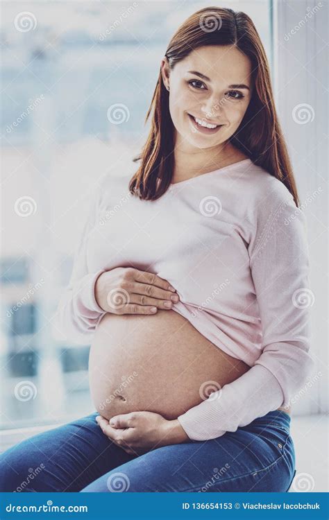 portrait of happy pregnant woman posing with bare belly stock image image of fertility
