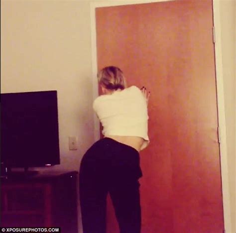 Miley Cyrus Shows Off Some Her Best Moves As She Gyrates Around Door