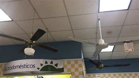 Westinghouse lighting 7224800 widespan industrial ceiling fan with remote, 100 inch, matte black. 3 Ceiling Fans on Display at a furniture store in a mall ...