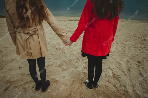 Premium Photo Two Girls Holding Hands
