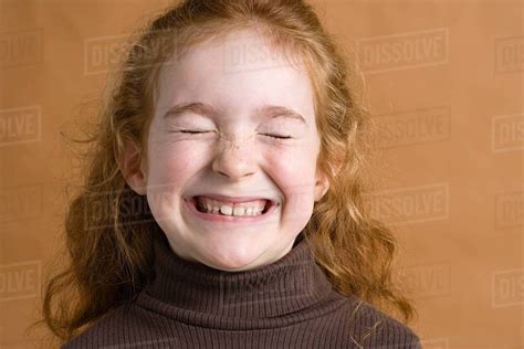 Girl Smiling With Eyes Closed Stock Photo Dissolve