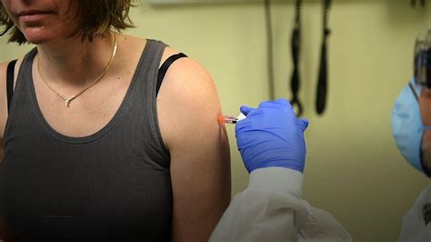 Volunteers Receive First Shot Of An Experimental COVID 19 Vaccine