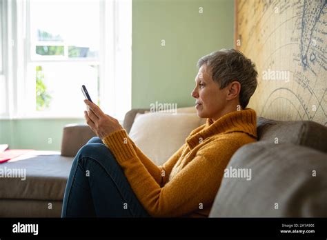 Mature Woman Alone At Home Stock Photo Alamy