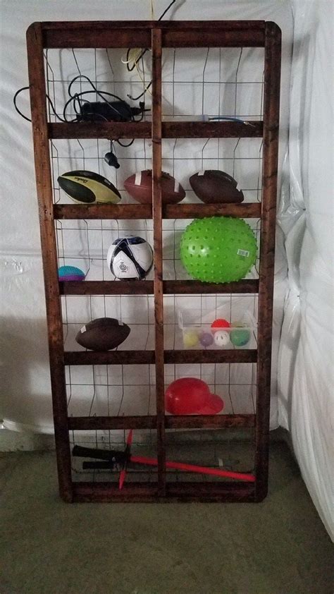 Old Box Springs Become A Storage Unit For Sport Equipment Rustic