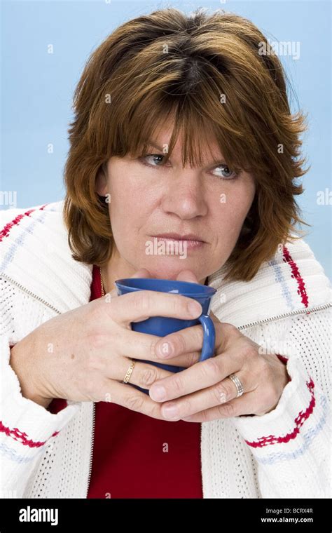 Grumpy Adult White Woman Drinking Coffee And Contemplating Stock Photo Alamy