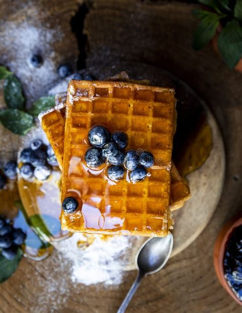 Waffles With Fresh Blueberries And Honey On The Rustic Table Freshly