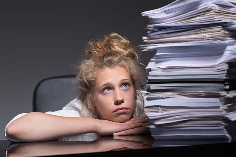 girl overwhelmed by paperwork erp software blog