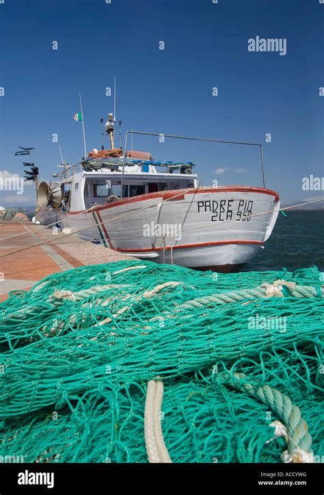 Fishing Boat And Net Sardinia Italy Stock Photo Alamy