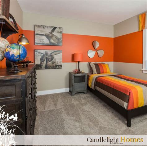 Orange colors used in living rooms add autumnul grace to your space. I like this light carpet, dark furniture and the large ...