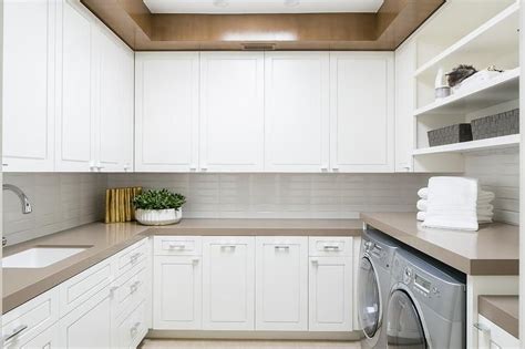 For a dose of inspiration, see these gorgeous kitchens with black cabinets from dering hall. White u-shaped laundry room with taupe accents boasts ...