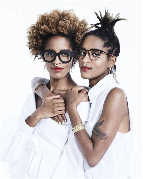 Two Women With Glasses Are Posing For The Camera