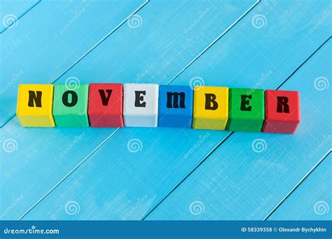 Word November On Color Wooden Cubes With Light Stock Photo Image Of