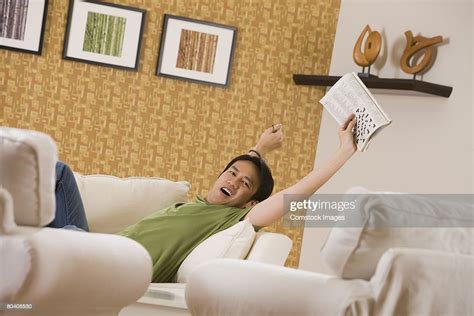 Man Stretching And Yawning On Couch High Res Stock Photo Getty Images