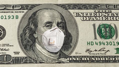 Face Of American President In Medical Mask On Dollar Bill During