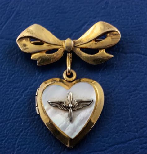 this beautiful ww ii military sweetheart locket pendant is heart shaped gold filled with a