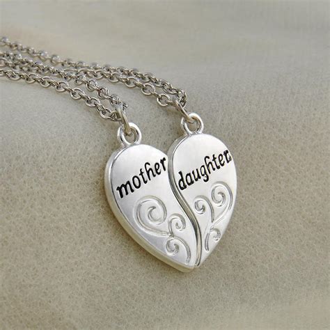 The next mother daughter jewelry is this adorable mother and child ring, a wonderful addition to any collection. Natalie Mother Daughter Heart Pendant Necklace - Quan Jewelry