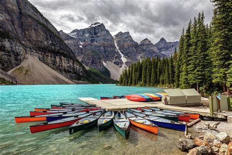 Colorful Canoes Of Moraine Lake Photograph By Pierre Leclerc