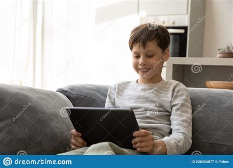 Cheerful Smiling Gen Z Teenage Kid Watching Virtual Lesson Stock Image