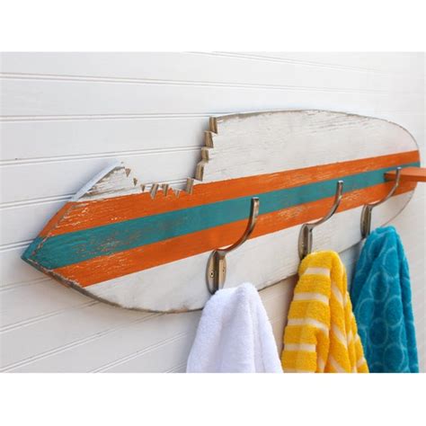 Five metal hangers hooks on a white wall. Surfboard Towel Hook Shark Bite Wooden Surfboard Towel ...