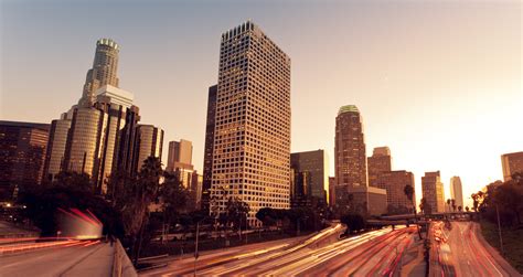 Los Angeles Urban City At Sunset With Freeway Trafic