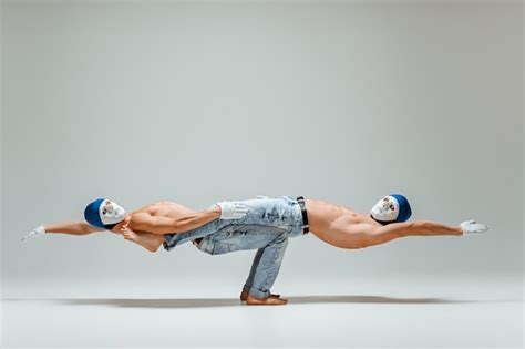 Free Photo Two Gymnastic Acrobatic Caucasian Men On Balance Pose