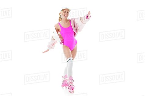 Blonde Woman In Pink Swimsuit Having Fun On Roller Skates Isolated On