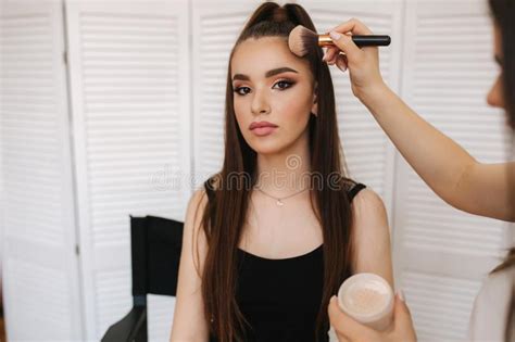 Female Makeup Master Use A Powder Brush Beautiful Model In Beauty