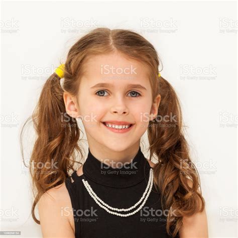 Happy Seven Years Old Girl Smiling At Camera Stock Photo Download