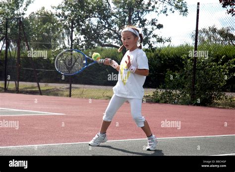 A Young Girl Playing Tennis Stock Photo Alamy